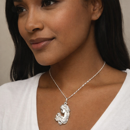Woman wearing a silver necklace with a mermaid pendant
