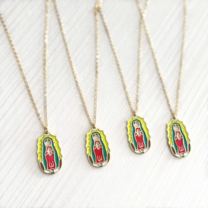Four gold necklaces with Guadalupe pendants on a white background