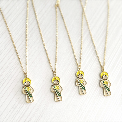 Gold necklaces with unique pendants of Saint Jude on a white background