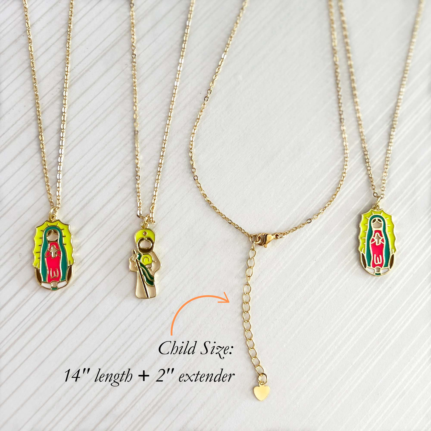 Three gold necklaces with Virgin Mary pendants on a white background