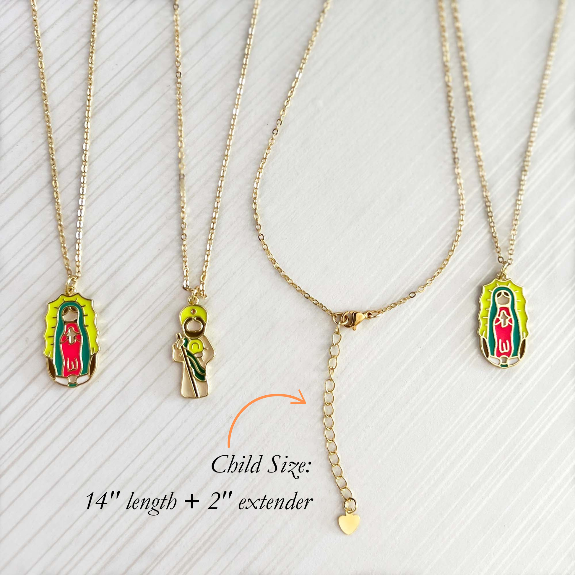 Three gold necklaces with Virgin Mary pendants on a white background