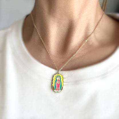 Necklace with a pendant featuring a religious icon on a white background