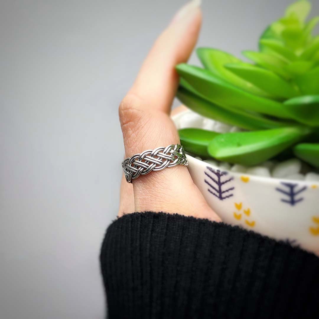 Our Aspen Ring is crafted from 925 Sterling silver and features an intricately braided design.